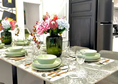 Elegant dining area with stylish table setting and floral centerpiece