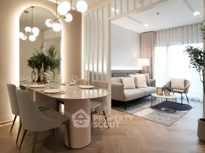 Elegant open-plan living and dining area with modern decor and natural light.
