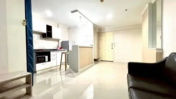 Spacious open-layout kitchen and living area with modern furnishings