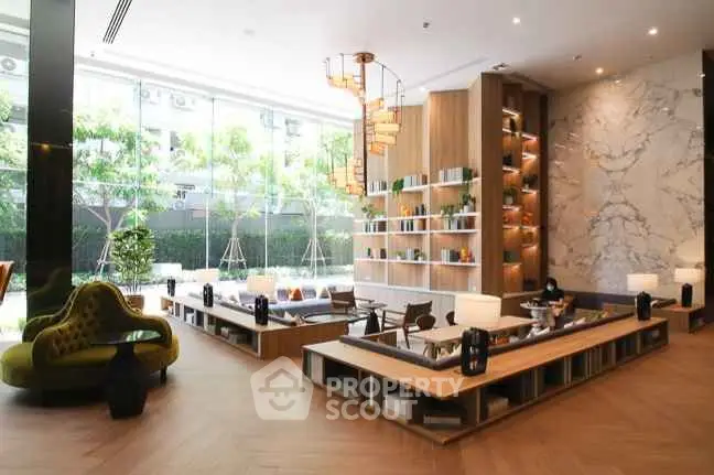 Luxurious modern living room with elegant decor and floor-to-ceiling windows.