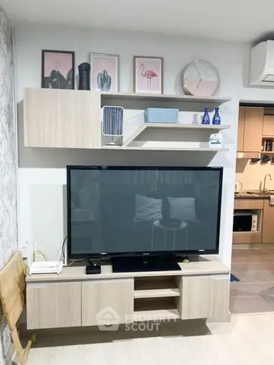 Modern living room with stylish TV unit and open kitchen layout