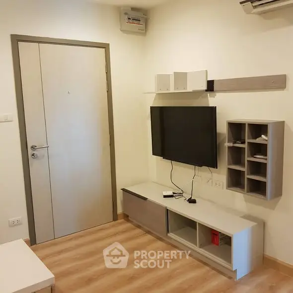 Modern living room with wall-mounted TV and stylish storage solutions