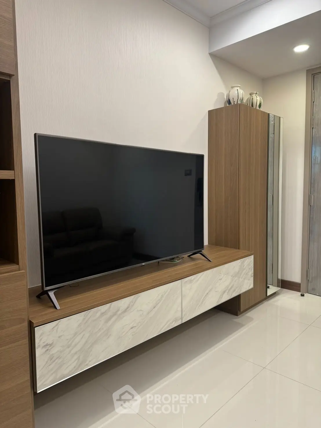 Modern living room with sleek TV unit and contemporary decor
