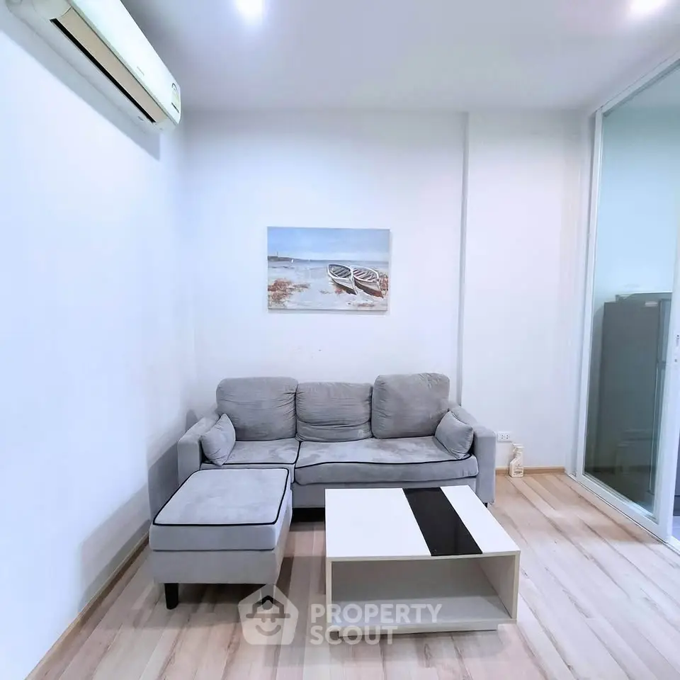 Modern living room with cozy gray sofa and stylish coffee table