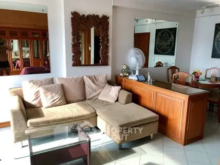 Spacious living room with elegant decor and comfortable seating in a modern apartment.