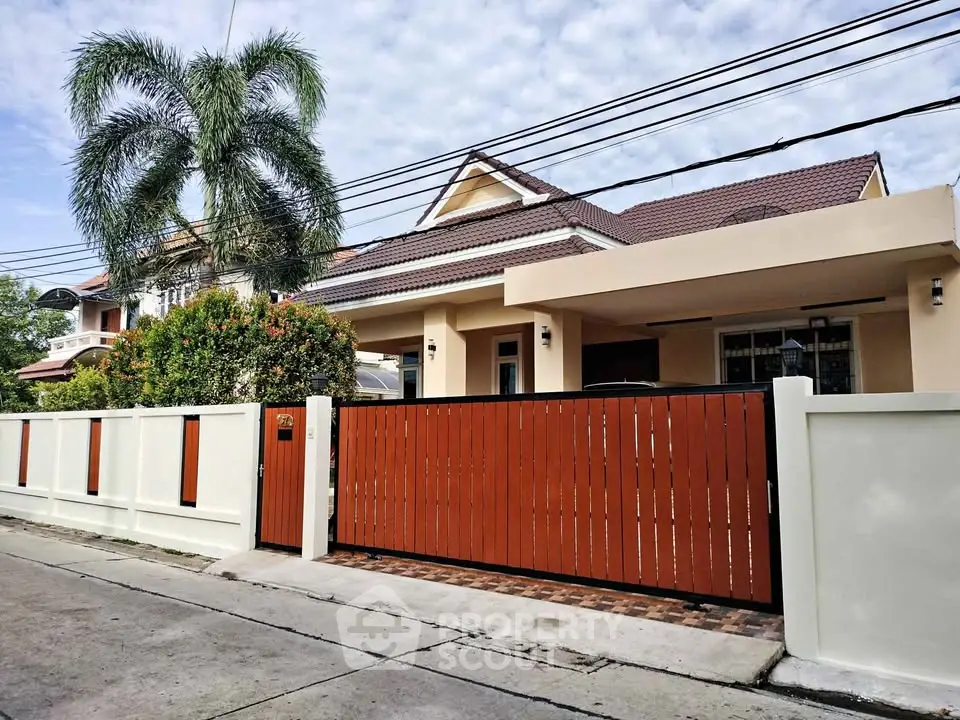 Charming suburban home with a spacious driveway and lush greenery, perfect for family living.