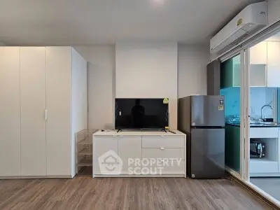 Modern living room with sleek furniture and integrated kitchen area