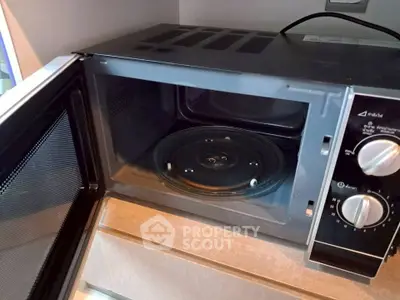 Modern kitchen with sleek microwave oven on countertop
