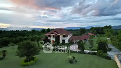 Luxurious countryside estate with expansive gardens and scenic mountain views