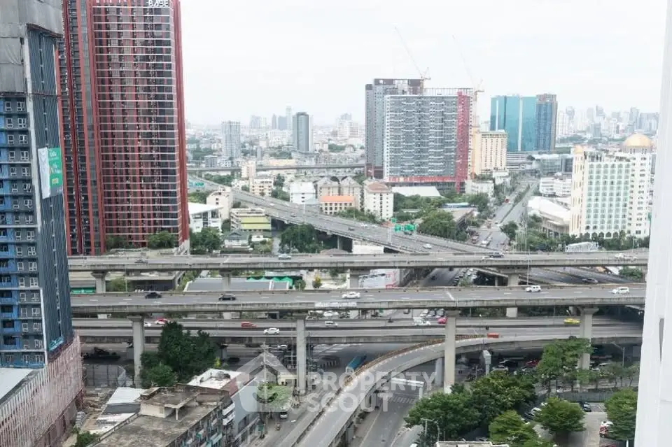 Stunning urban cityscape view with high-rise buildings and highway infrastructure, perfect for modern living.