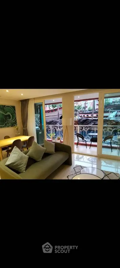 Stylish living room with balcony access and modern decor