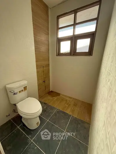 Modern bathroom with natural light and sleek tile design