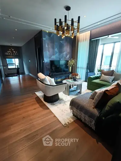 Luxurious modern living room with elegant decor and ample natural light.