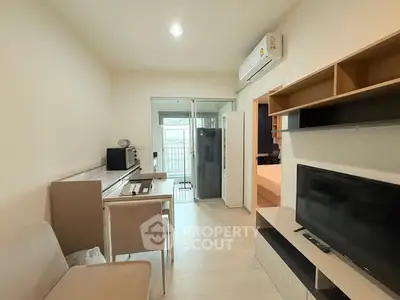 Modern living room with sleek furniture and balcony access in a stylish apartment.