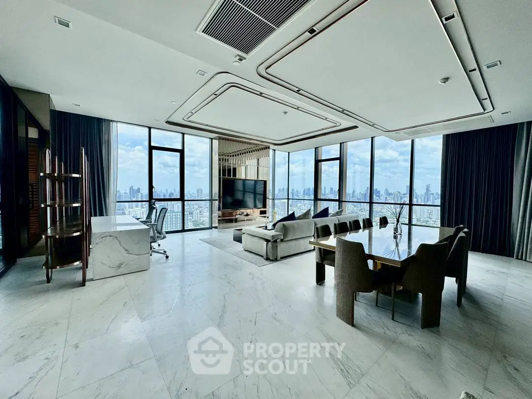 Luxurious modern living room with panoramic city views and elegant furnishings.