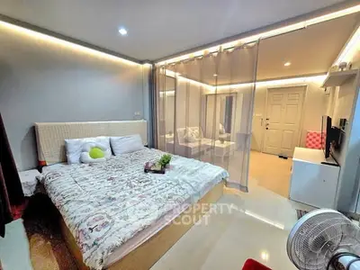 Modern bedroom with cozy lighting and stylish decor in a contemporary apartment.
