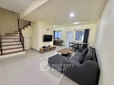 Spacious living room with modern furniture and open layout