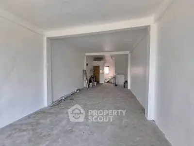 Spacious unfinished interior space ideal for customization in real estate property.