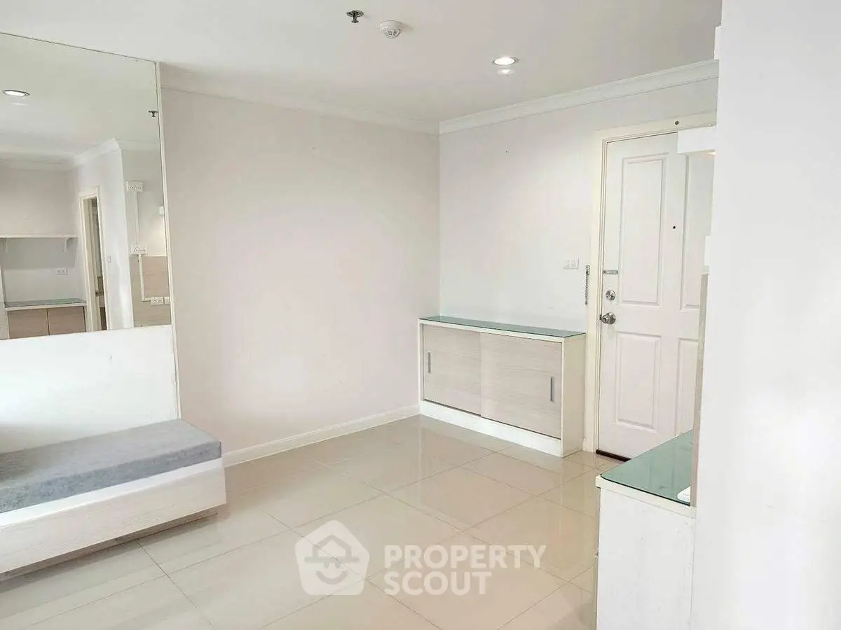 Modern minimalist interior with sleek white walls and tiled flooring