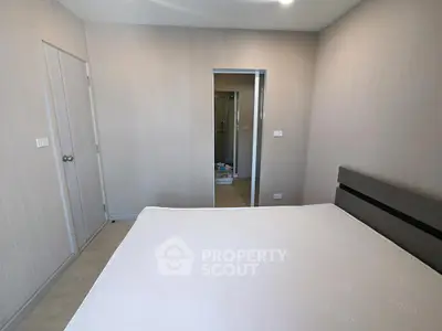 Modern minimalist bedroom with sleek design and neutral tones