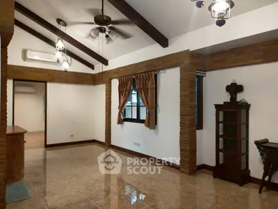 Spacious living room with high ceilings and elegant lighting