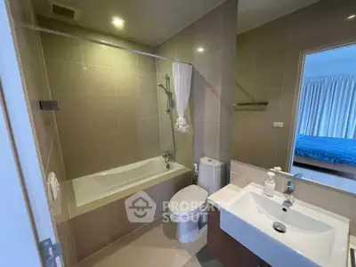 Modern bathroom with bathtub and sleek fixtures in a stylish apartment