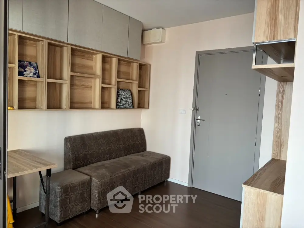 Modern compact living room with stylish shelving and cozy seating