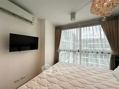 Modern bedroom with large windows, air conditioning, and elegant chandelier in a high-rise apartment.