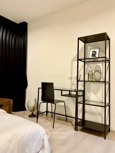 Modern bedroom with sleek study area and minimalist decor