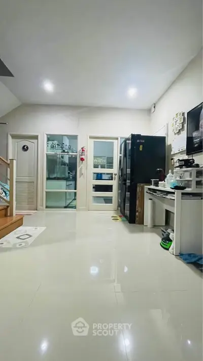 Spacious kitchen with modern appliances and sleek design, perfect for culinary enthusiasts.