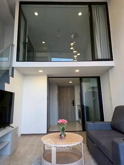 Modern duplex living room with high ceiling and stylish decor