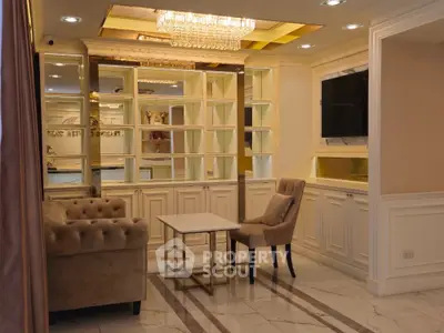 Luxurious living room with elegant chandelier and plush seating