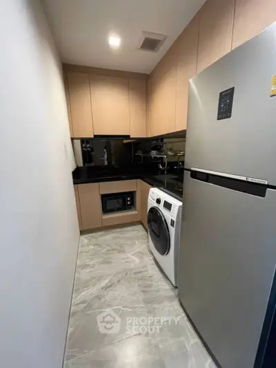 Modern kitchen with sleek appliances and stylish cabinetry