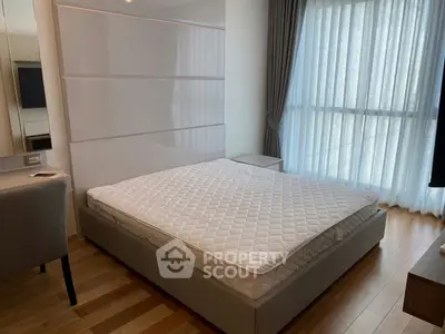 Modern bedroom with large window and stylish decor