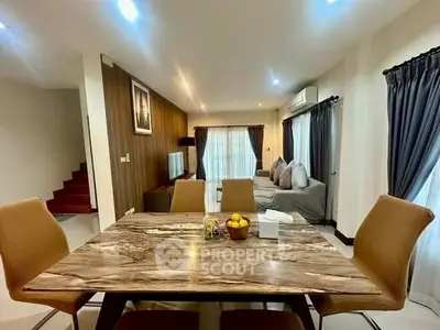 Spacious modern living room with elegant dining area and stylish decor