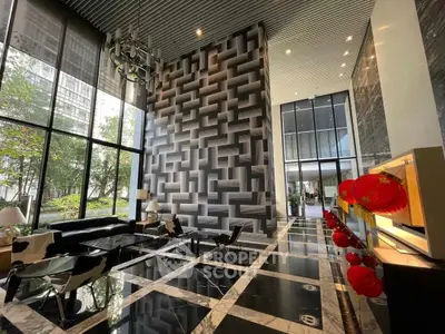 Luxurious modern lobby with high ceilings and elegant decor