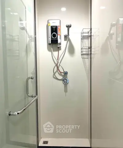 Modern bathroom shower with glass door and water heater