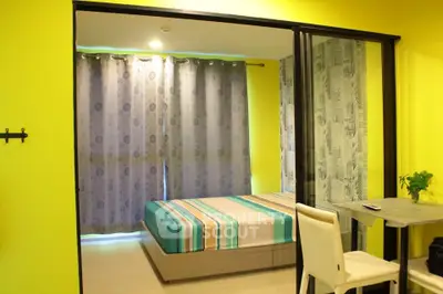 Modern bedroom with vibrant yellow walls and stylish decor