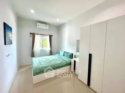 Modern bedroom with minimalist design and natural light