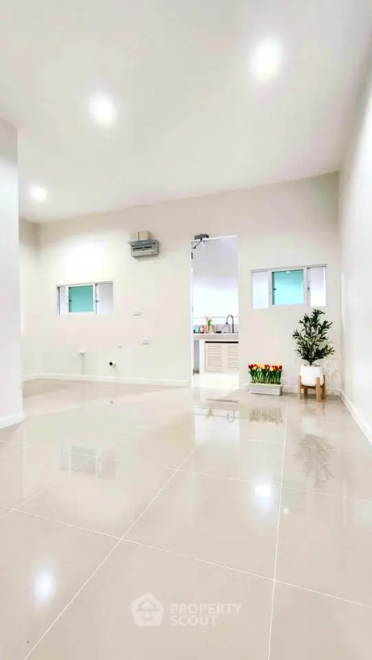 Spacious modern interior with glossy tile flooring and minimalist decor