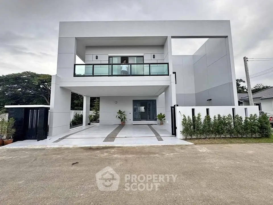 Modern two-story house with sleek design and spacious driveway
