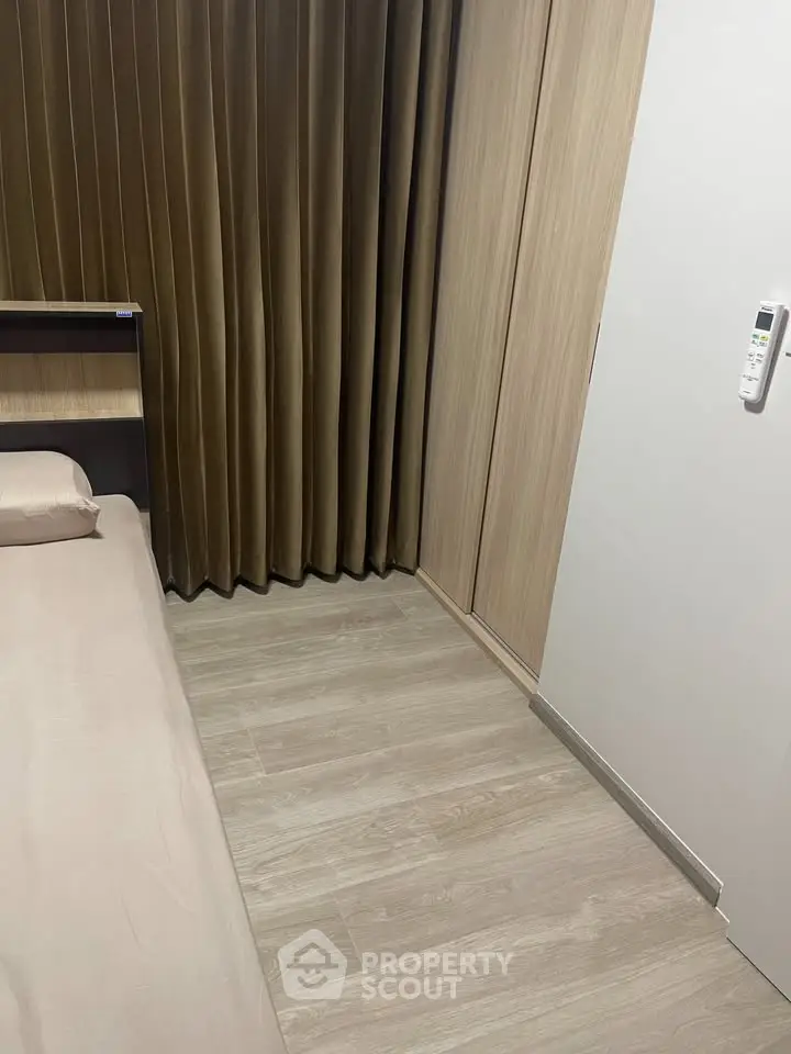 Modern bedroom with wooden flooring and sleek design