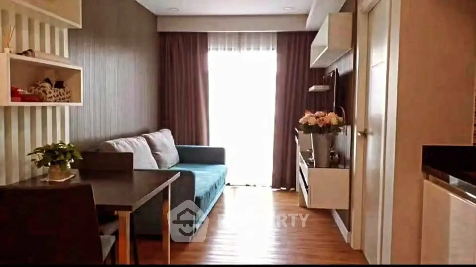 Charming living room with cozy sofa and modern decor, perfect for relaxation and entertainment.