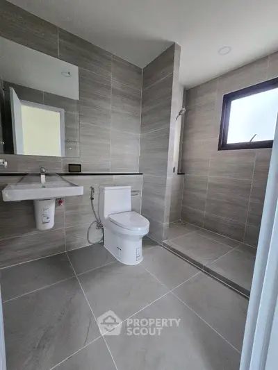 Modern bathroom with sleek tile design and walk-in shower