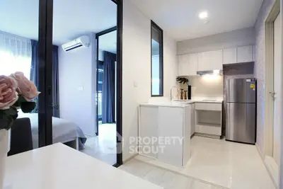Modern open-plan kitchen with sleek appliances and bright interior design