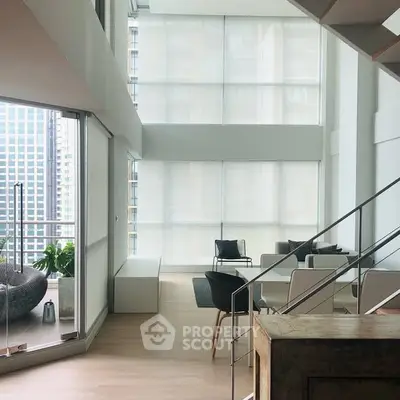 Modern high-rise apartment with floor-to-ceiling windows and stylish balcony view.