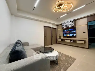 Modern living room with stylish lighting and sleek entertainment center