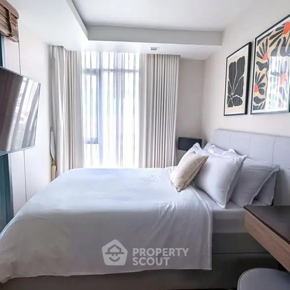 Modern bedroom with stylish decor and natural light