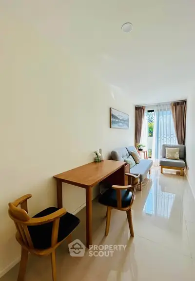 Bright and airy living room with modern furniture and large window view.