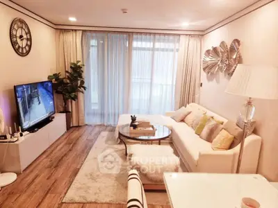 Elegant living room with modern decor and large windows